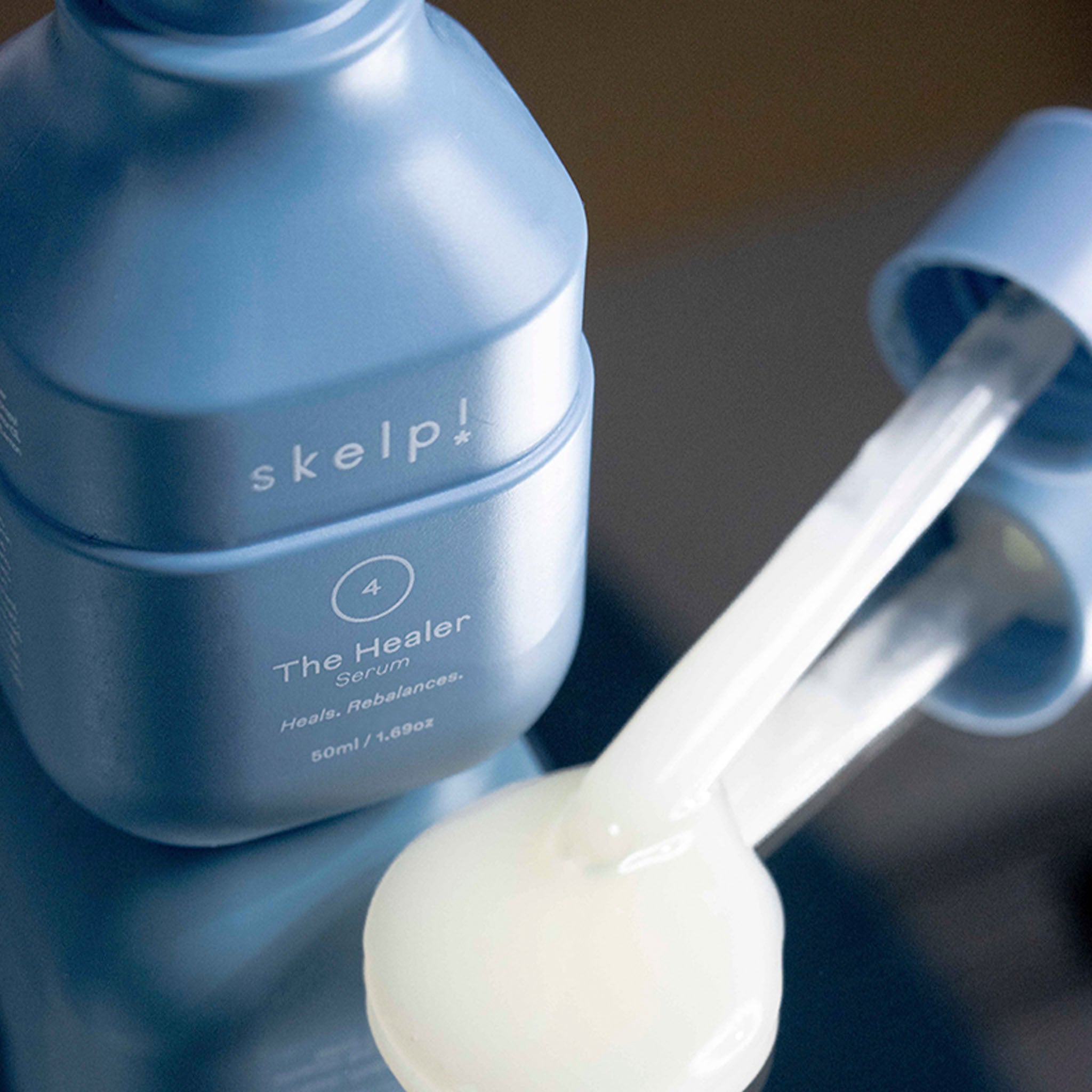 skelp The Healer Serum product shot with formulation next to bottle.